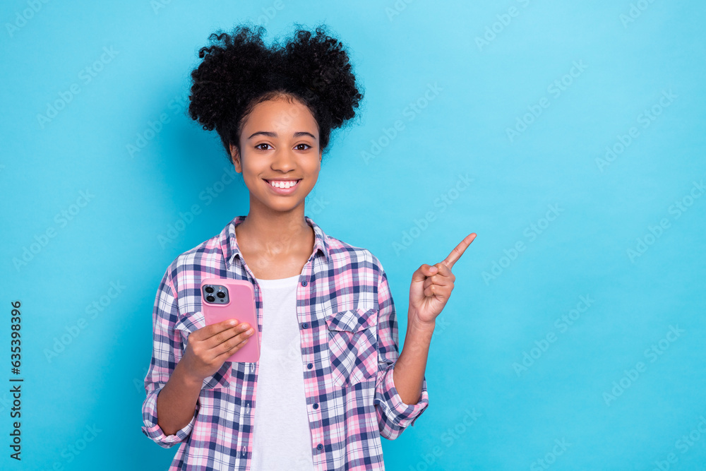 Poster portrait of funny person with afro hairstyle wear plaid shirt indicating empty space hold smartphone