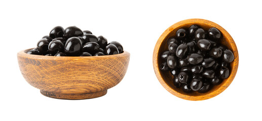 Tasty black olives in a wooden bowl with leaves isolated on a white background. Vegan. Design.