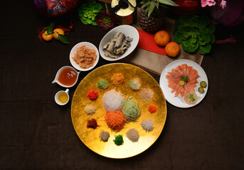 fresh colourful asian festive vegetables salad lo hei yu sheng with smoked salmon, fish skin, cookies and sweet spicy sauce buffet corner for chinese new year halal food menu for banquet restaurant