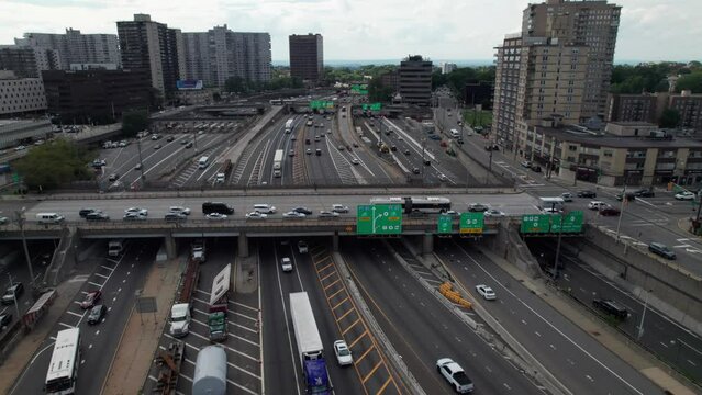 Complicated traffic pattern with signs, highways, trucks and cars, 4K aerial