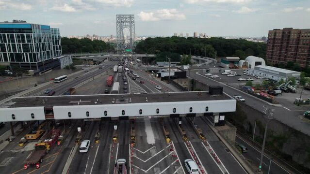 Toll plaza, trucks and cars going through EZ Pass scanners. New York City, 4K