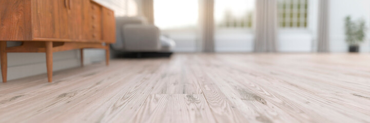 Shallow depth of field on a wooden floor in a modern living space with bright windows 3d render