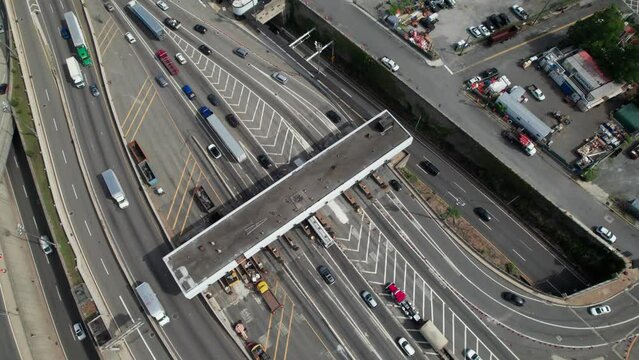 Overhead aerial of a toll plaza bottleneck, 4K