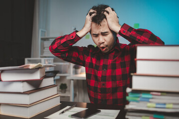 Startup company employees working in the office overtime are stressed and tired from overtime work,...