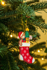 Small stocking ornament on a christmas tree