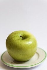 green apple on a plate