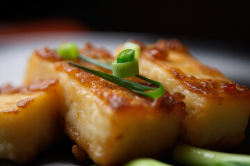 Fried turnip cake with soy sauce and scallions, a savory Chinese dim sum delicacy, captured in a delectable macro shot.