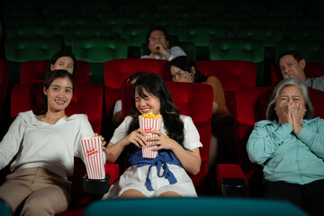When watching scary ghost movies in theaters, moviegoers appear terrified.