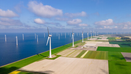 Windmill park with clouds and a blue sky, windmill park in the ocean aerial view with wind turbine Flevoland Netherlands Ijsselmeer. Green Energy production in the Netherlands