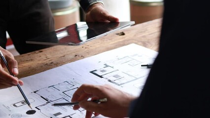 The home design architects are reviewing the house plan draft, the project commissioned by the client, and the custom design before delivery. Interior design and decoration ideas. - Powered by Adobe
