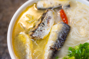 Sardines fish with instant noodles in restaurant