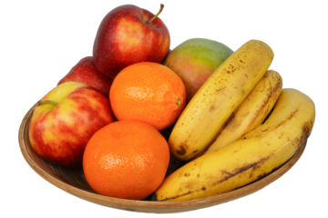 Fruits. Ripe and tasty fruits in a wooden bowl.