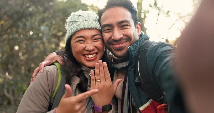 Engagement, selfie and couple with ring on hand for social media, profile picture or happy outdoor proposal on hiking adventure. Portrait, man and woman smile with diamond, jewelry and love together