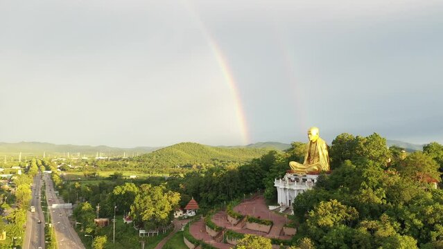 Aerial view The Rainbow and Kruba Srivichai statue at Wat Doi Ti the old history temple in Lumphun, Thailand.