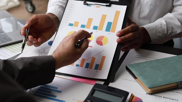 Atmosphere of a startup company meeting, business people are meeting together to summarize and plan investment finances, they are the founders of the company. Business administration concept.