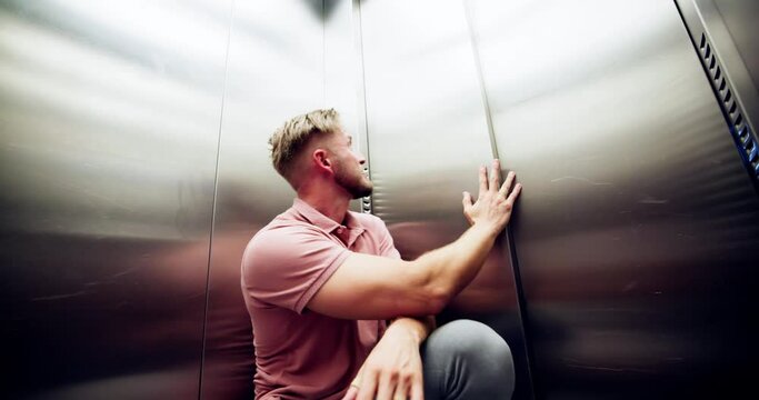 Man Suffering From Claustrophobia Trapped Inside Elevator