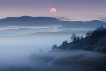 sunrise over foggy mountains, morning landscape