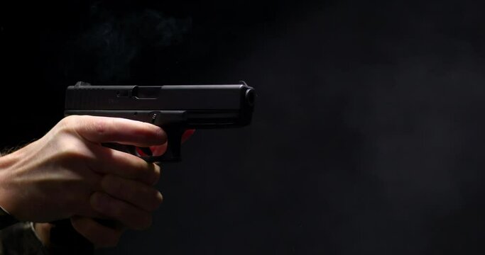 4K - Pistol shot. Close-up scene with sound