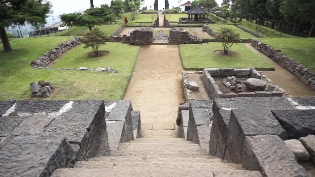 The view of Cetho Temple, an ornament in the shape of a giant tortoise, which is thought to be the symbol of Majapahit, is on the third terrace.