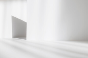 Abstract white studio background for product presentation. Empty gray room with shadows of window....
