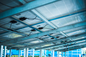 Solar cell connector. Solar PV connector of the solar cell circuit and wires under the solar panel in a smart farm. Choose to focus closer to the subject.