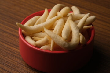 telur gabus keju. cheese scrambled eggs in red bowl. savory snack from Indonesia. 