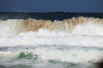 Abstract landscape with sea waves at the shore on a windy day.