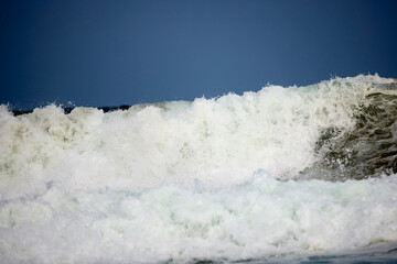 Abstract landscape with sea waves at the shore on a windy day.