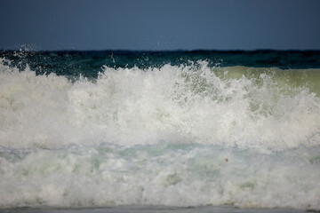 Abstract landscape with sea waves at the shore on a windy day.