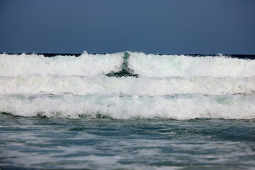 Abstract landscape with sea waves at the shore on a windy day.