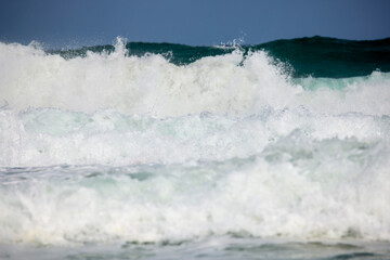Abstract landscape with sea waves at the shore on a windy day.