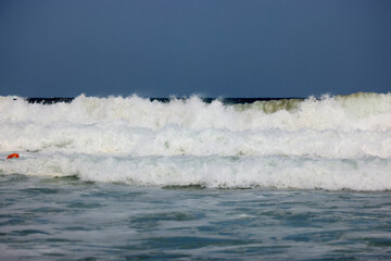 Abstract landscape with sea waves at the shore on a windy day.