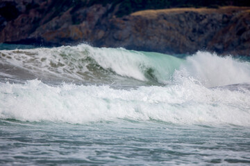 Abstract landscape with sea waves at the shore on a windy day.