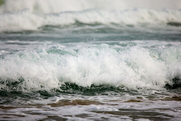 Abstract landscape with sea waves at the shore on a windy day.