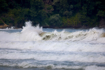 Abstract landscape with sea waves at the shore on a windy day.