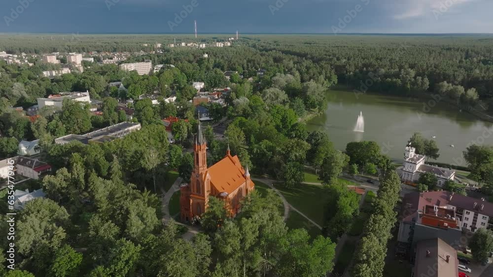 Wall mural Aerial view of Lithuanian resort Druskininkai. Panoramic view of Lithuanian resort Druskininkai church in city park. A spa town on the Nemunas river