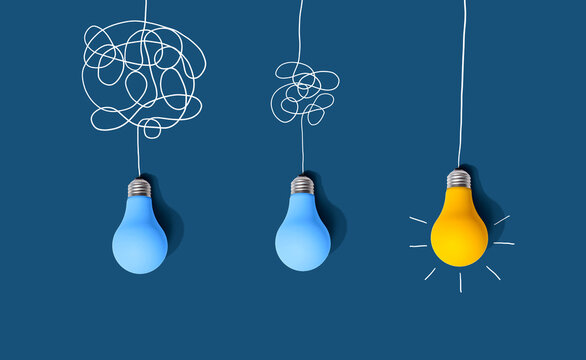 Clarifying complex ideas through the glow of lightbulbs - Flat lay