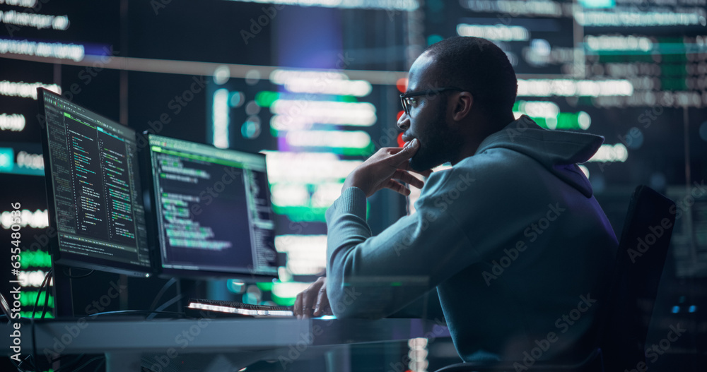 Poster Focused Black Male Programmer Working in Monitoring Room, Surrounded by Big Screens Displaying Lines of Programming Language Code. Portrait of Man Creating Software. Abstract Futuristic Coding Concept