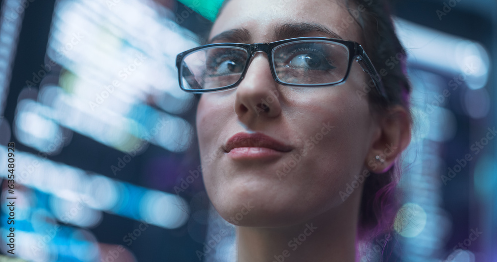 Aufkleber Close Up Portrait of Smiling Woman Looking Around, Lines of Code Language Reflected on her Glasses from Big Display Screens Surrounding her. Professional Female Programmer Developing Software, Coding