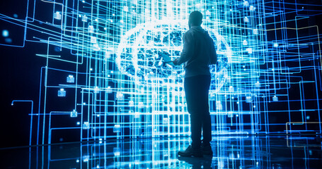 Back View of Young Man Looking at a Big Screen with Neural Network 3D Visualisation. Professional Computer Data Science Engineer Working in System Control and Monitoring Telecommunications