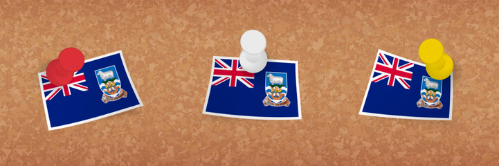 Falkland Islands flag pinned in cork board, three versions of Falkland Islands flag.