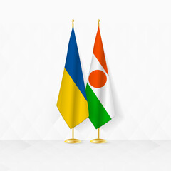 Ukraine and Niger flags on flag stand, illustration for diplomacy and other meeting between Ukraine and Niger.