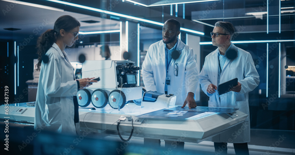 Poster Industrial Robotics Specialists Working on a Mobile Robot, Using Tablet Computer. Black African Engineer In Lab Coat Discussing an Automated AI Robotic Delivery Assistant with His Creative Team