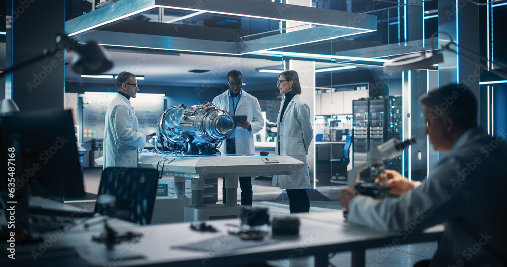 Poster Thrust Engine Engineer, Project Manager and Machinery Operator Work on a Futuristic Turbine Motor, Standing with Tablet Computer in Scientific Technology Lab. Professional Team Developing a Prototype