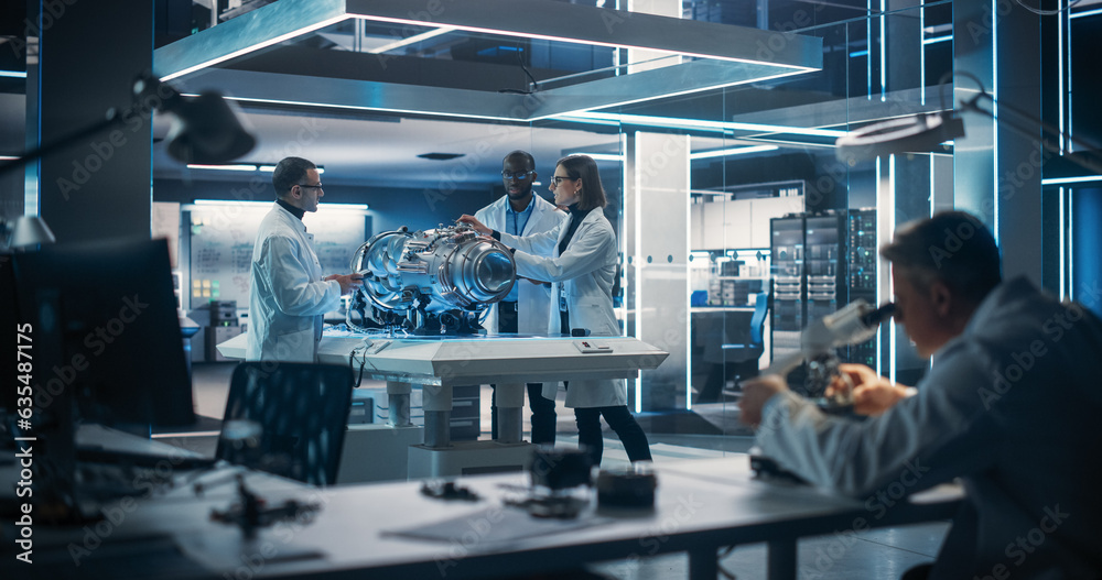 Aufkleber Thrust Engine Engineer, Project Manager and Machinery Operator Work on a Futuristic Turbine Motor, Standing with Tablet Computer in Scientific Technology Lab. Professional Collegue Using Microscope.