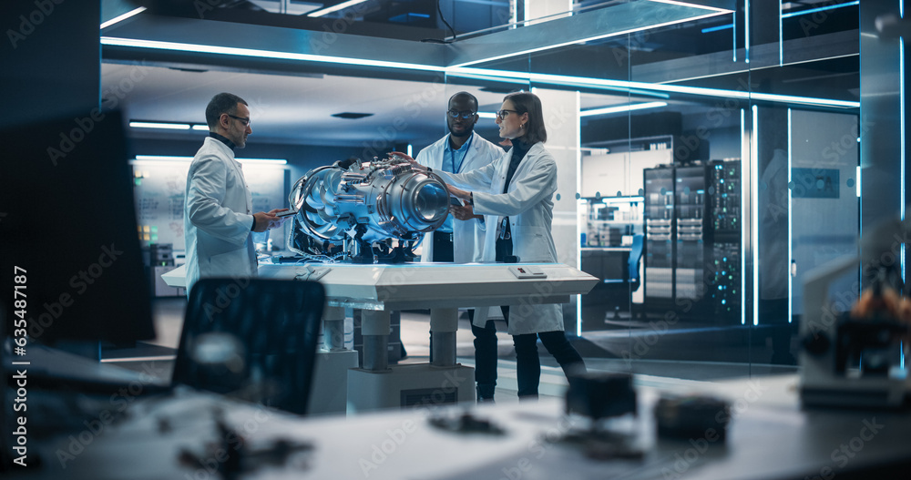 Aufkleber Smart Team of Engineers, Project Manager and Machinery Operators Collaborate on a New Type of a Electric Turbine Engine, Standing with Tablet and Laptop Computers in Scientific Technology Laboratory
