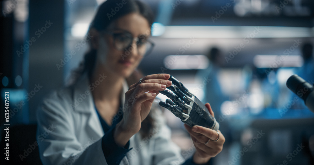 Leinwandbilder Young Female Scientist Working in Technological Research and Development Company, Assembling an Innovative Bionic Prosthetic Hand. Engineer Working on Technology for Physically Impaired People