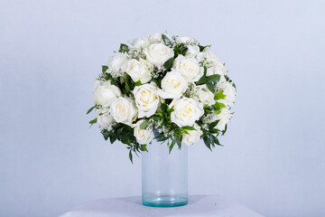 Many kinds of beautiful flowers put in vase on a white background