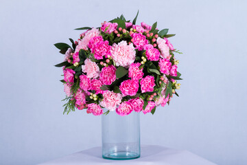 Many kinds of beautiful flowers put in vase on a white background