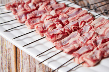 Raw lamb skewers on a plate
